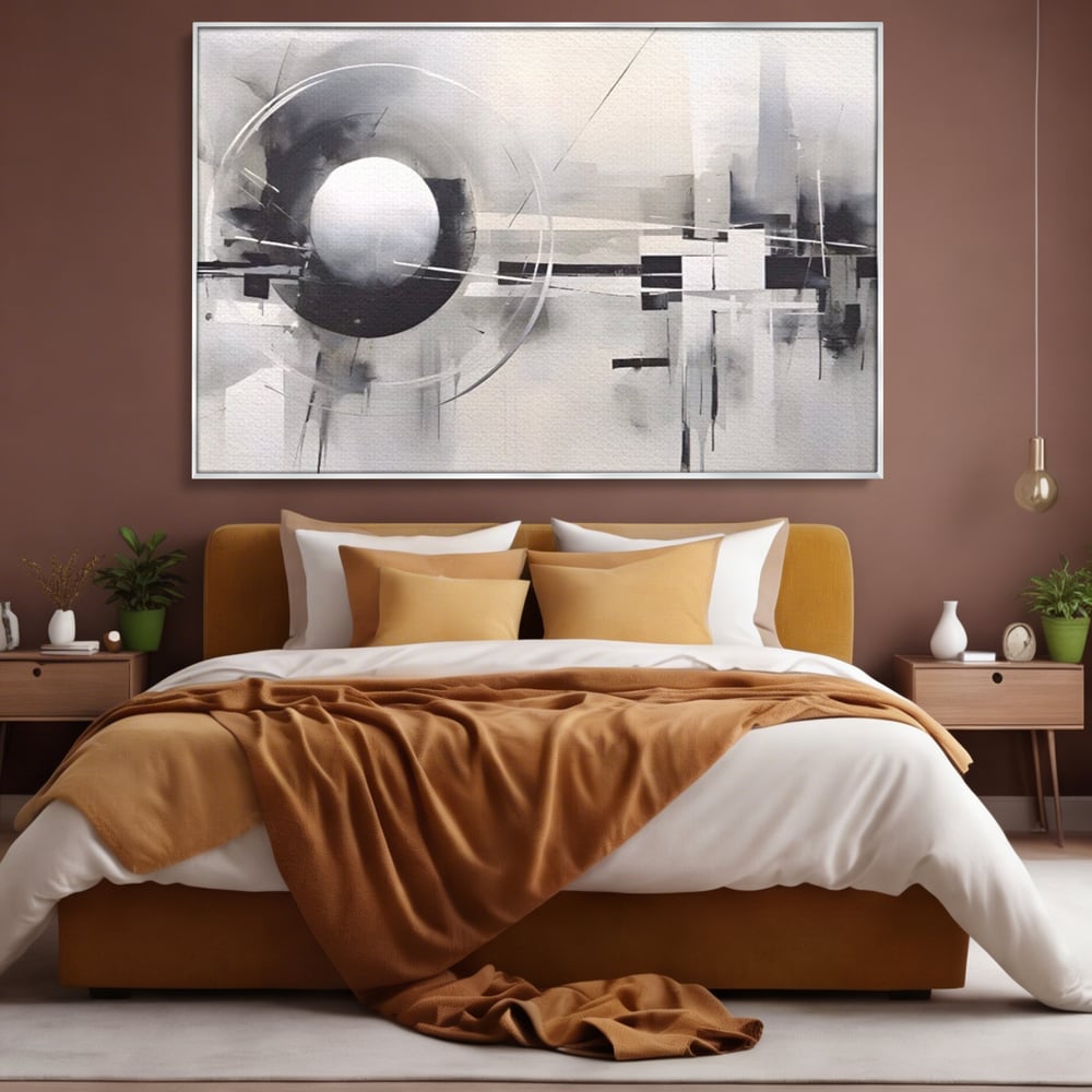 Tablou canvas cu pictura abstracta cu sfera si cercuri, in rama de aluminiu argintiu, pe perete intr-un dormitor